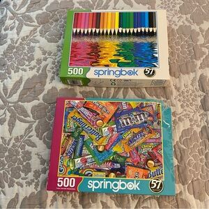 2 Springbok 500 piece puzzles featuring candy M&Ms and colorful pencils